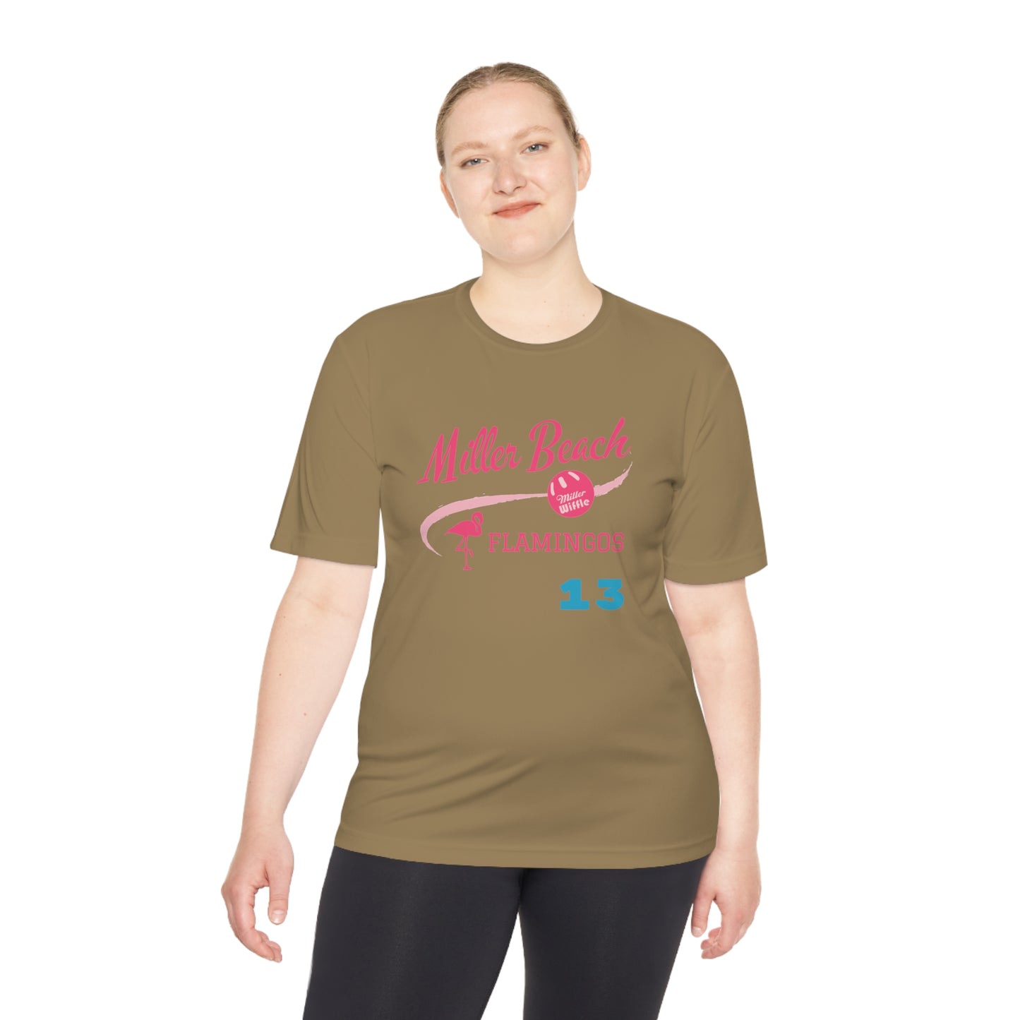 A beige Printify Miller Beach Flamingos - Dudzik 13 Unisex Moisture Wicking Tee with "Miller Beach Flamingos" printed in pink and red across the chest. The design features a flamingo icon, a volleyball, and the number 13 in blue. This lightweight moisture-wicking shirt is perfect for custom sports shirts and active lifestyles.