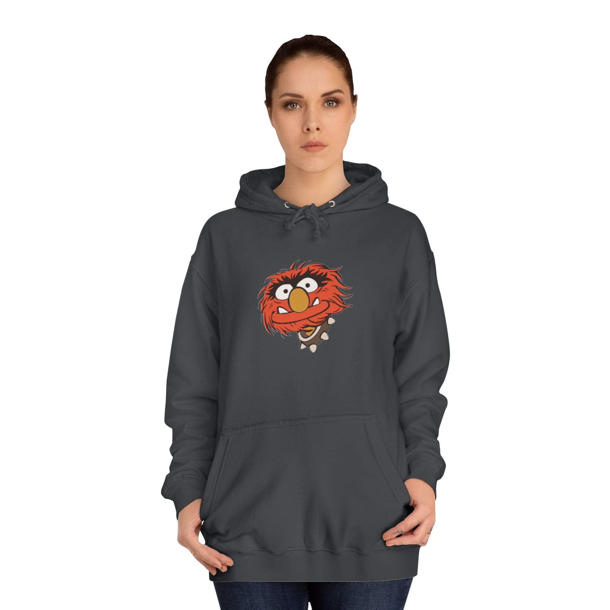 This comfy unisex college hoodie by Printify showcases a vibrant design of a cartoon character with wild orange hair, bulging eyes, and a broad grin on the front, embodying that lively spirit. It's like wearing the Animal - The Muppets hoodie without sacrificing comfort.