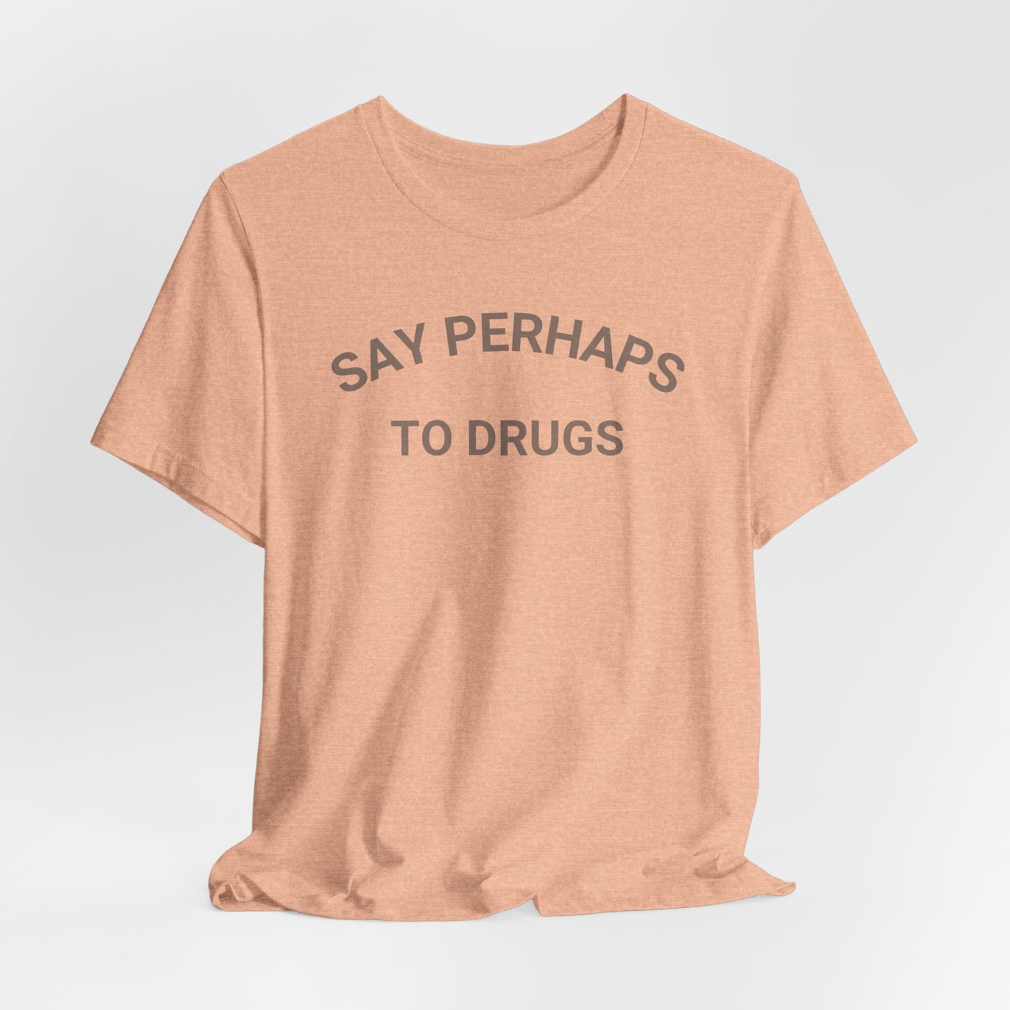 A Printify "Say Perhaps to Drugs" unisex jersey short sleeve tee in blue, featuring the text "SAY PERHAPS TO DRUGS" in dark letters across the front. The soft cotton shirt is displayed against a plain white background.