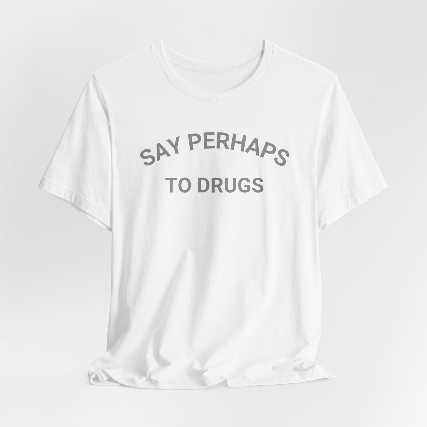 A Printify "Say Perhaps to Drugs" unisex jersey short sleeve tee in blue, featuring the text "SAY PERHAPS TO DRUGS" in dark letters across the front. The soft cotton shirt is displayed against a plain white background.
