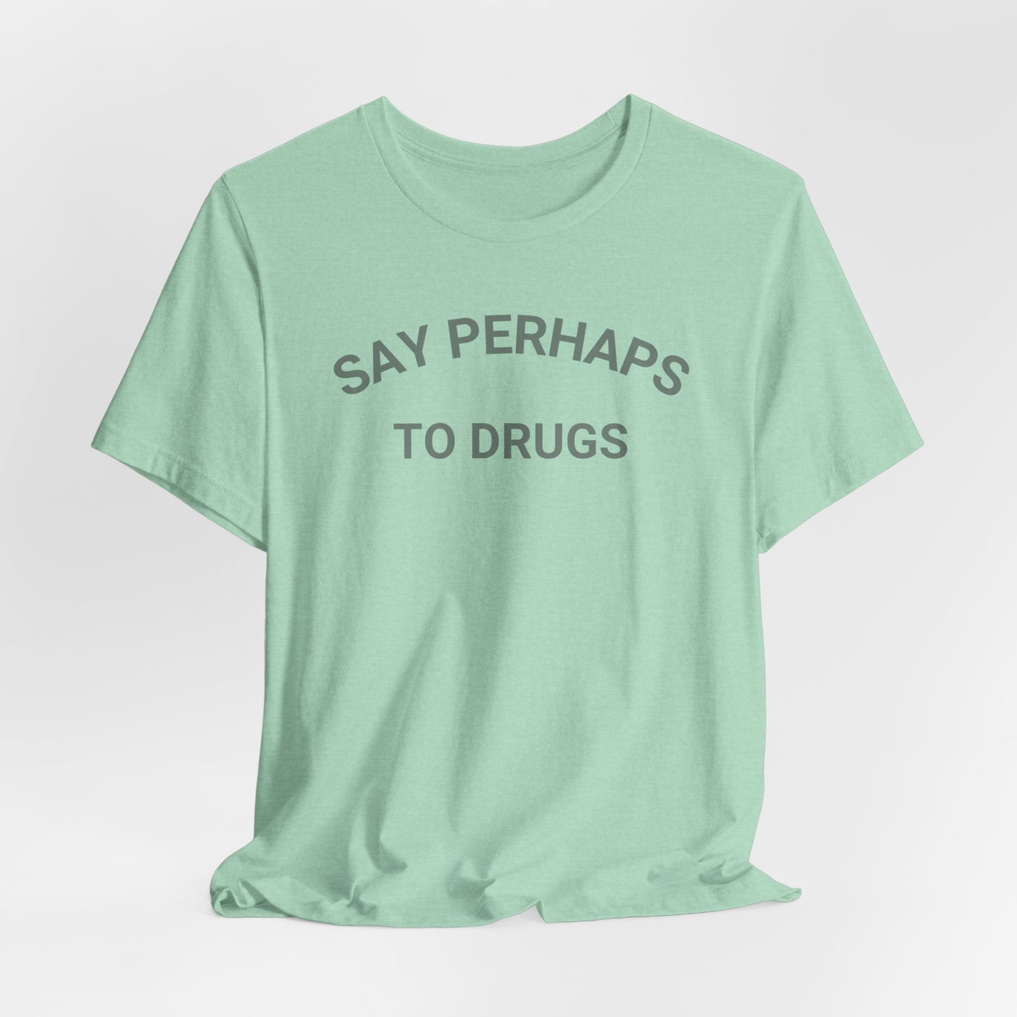 A Printify "Say Perhaps to Drugs" unisex jersey short sleeve tee in blue, featuring the text "SAY PERHAPS TO DRUGS" in dark letters across the front. The soft cotton shirt is displayed against a plain white background.