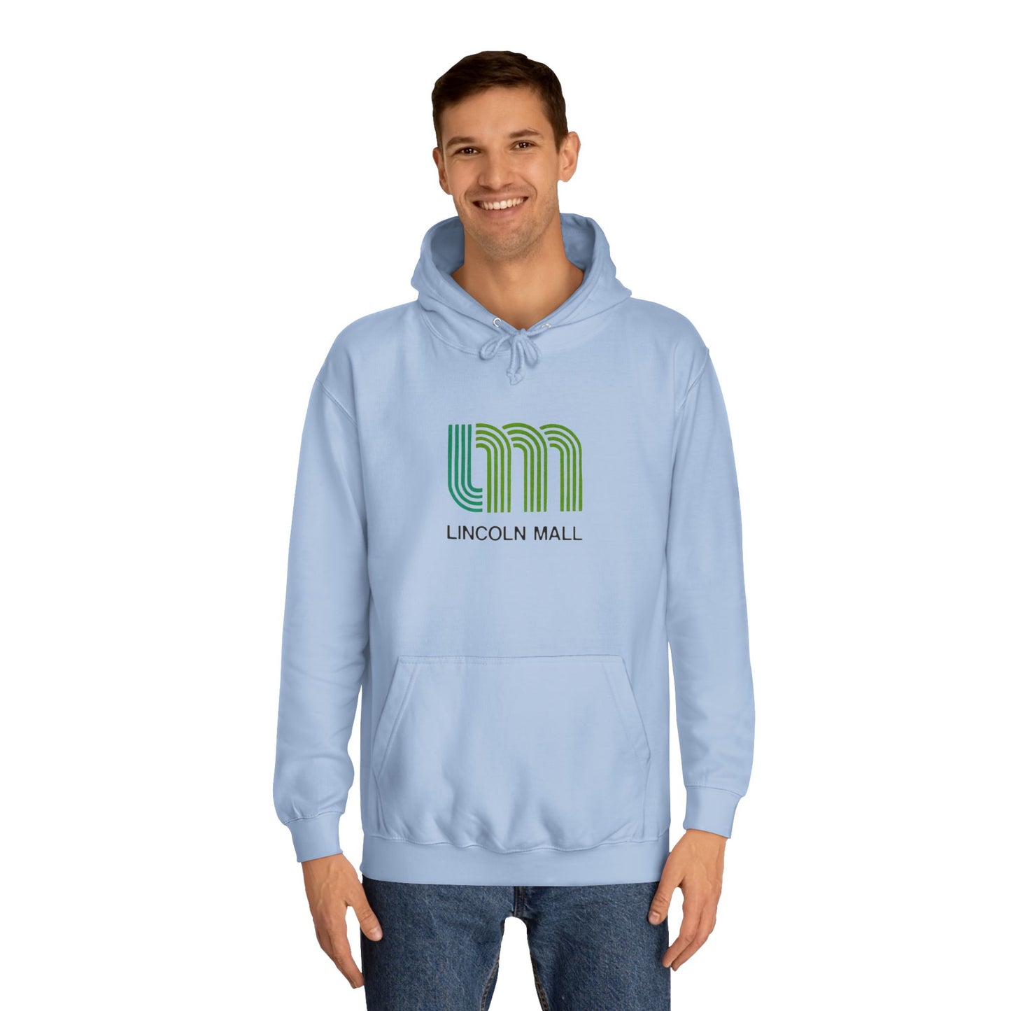 This unisex college hoodie by Printify features a gray design with a stylized green "LM" logo above the text "Lincoln Mall," inspired by the 1980s. It comes complete with a front pocket and drawstrings, capturing the retro style of Lincoln Mall, Matteson, IL.