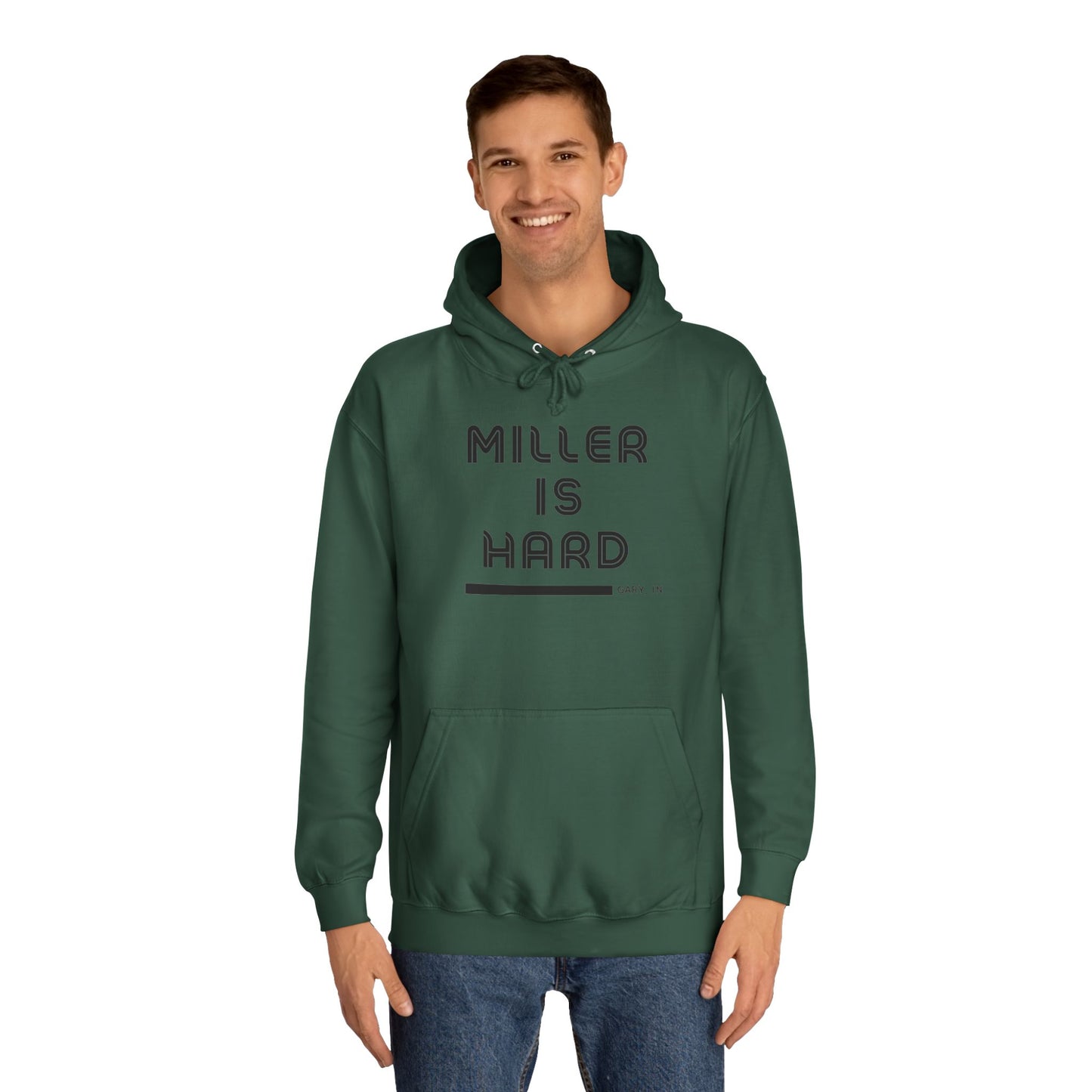 A light blue unisex college hoodie from Printify features the bold black text "MILLER IS HARD" on the front, with "GARY, IN." in smaller letters below. This hoodie is equipped with a front pocket and adjustable drawstrings, ideal for those who appreciate the Miller Beach style.