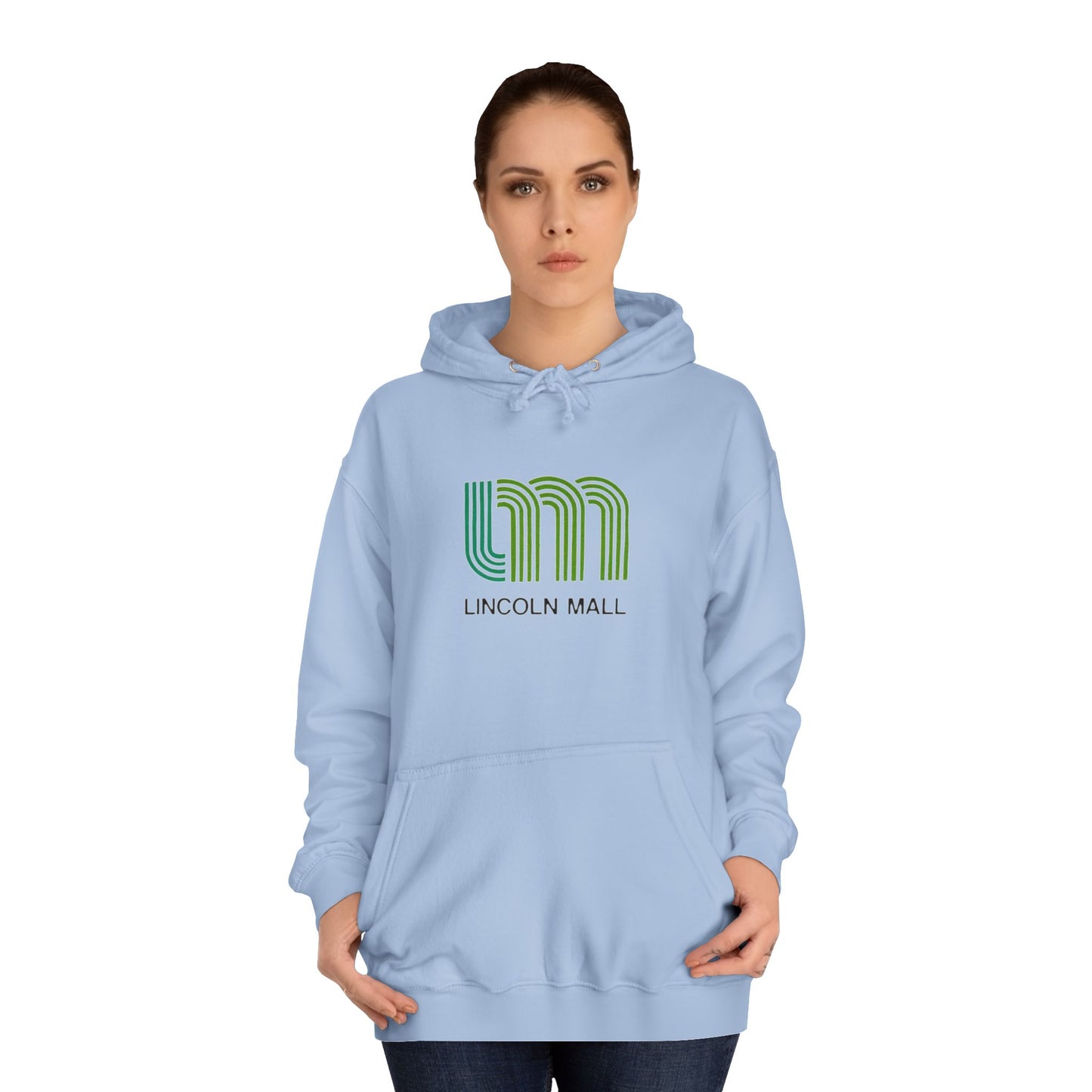 This unisex college hoodie by Printify features a gray design with a stylized green "LM" logo above the text "Lincoln Mall," inspired by the 1980s. It comes complete with a front pocket and drawstrings, capturing the retro style of Lincoln Mall, Matteson, IL.