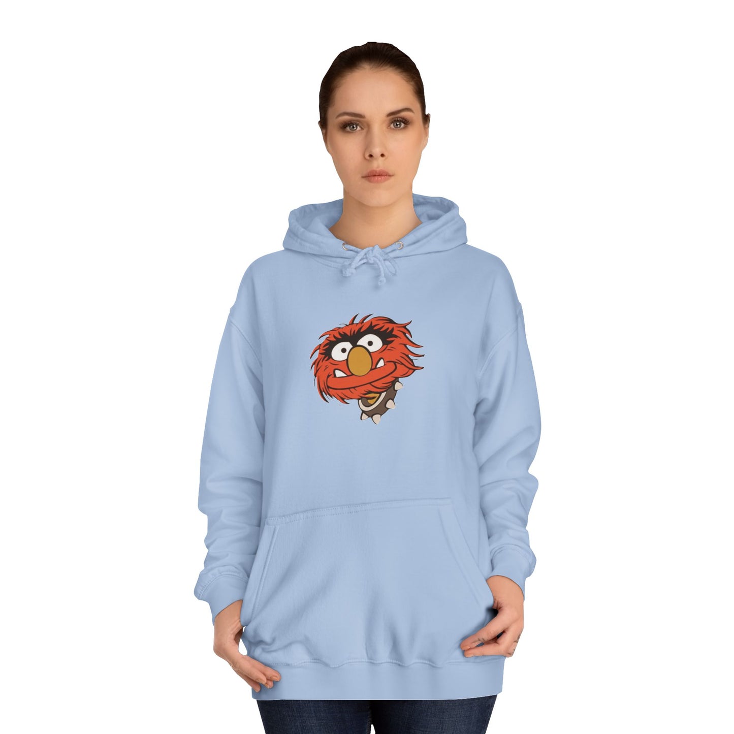 This comfy unisex college hoodie by Printify showcases a vibrant design of a cartoon character with wild orange hair, bulging eyes, and a broad grin on the front, embodying that lively spirit. It's like wearing the Animal - The Muppets hoodie without sacrificing comfort.