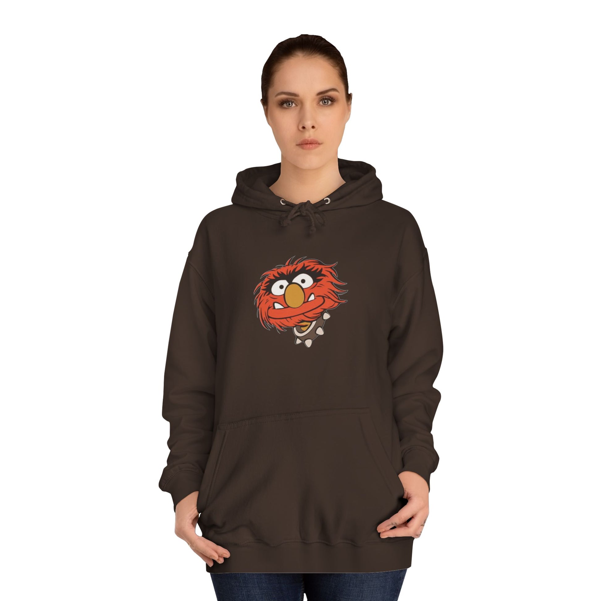 This comfy unisex college hoodie by Printify showcases a vibrant design of a cartoon character with wild orange hair, bulging eyes, and a broad grin on the front, embodying that lively spirit. It's like wearing the Animal - The Muppets hoodie without sacrificing comfort.