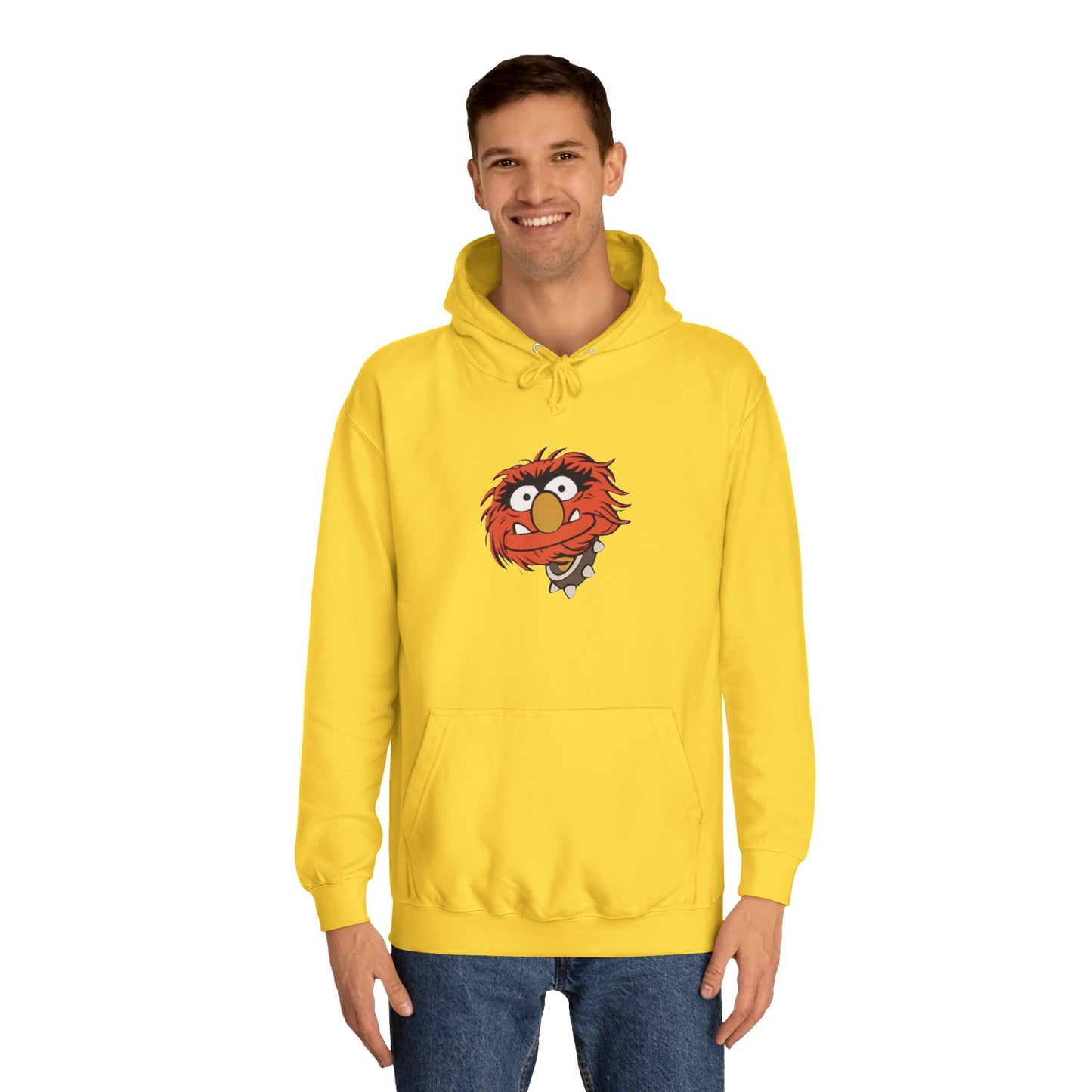 This comfy unisex college hoodie by Printify showcases a vibrant design of a cartoon character with wild orange hair, bulging eyes, and a broad grin on the front, embodying that lively spirit. It's like wearing the Animal - The Muppets hoodie without sacrificing comfort.