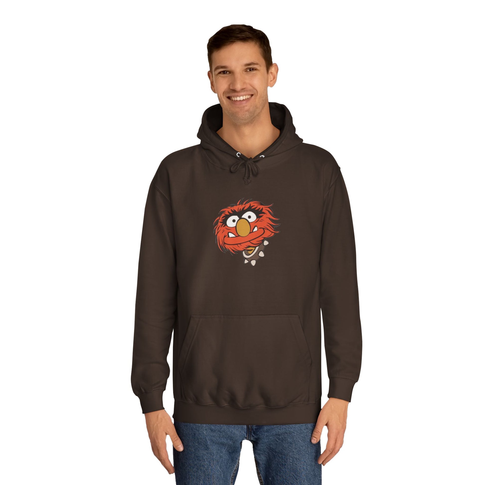 This comfy unisex college hoodie by Printify showcases a vibrant design of a cartoon character with wild orange hair, bulging eyes, and a broad grin on the front, embodying that lively spirit. It's like wearing the Animal - The Muppets hoodie without sacrificing comfort.