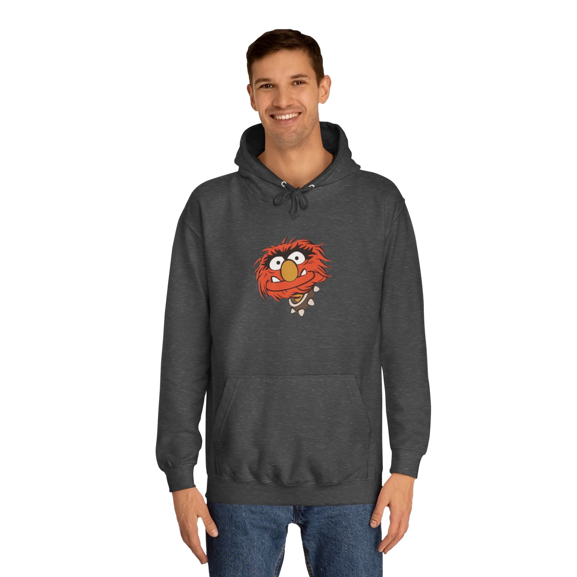 This comfy unisex college hoodie by Printify showcases a vibrant design of a cartoon character with wild orange hair, bulging eyes, and a broad grin on the front, embodying that lively spirit. It's like wearing the Animal - The Muppets hoodie without sacrificing comfort.