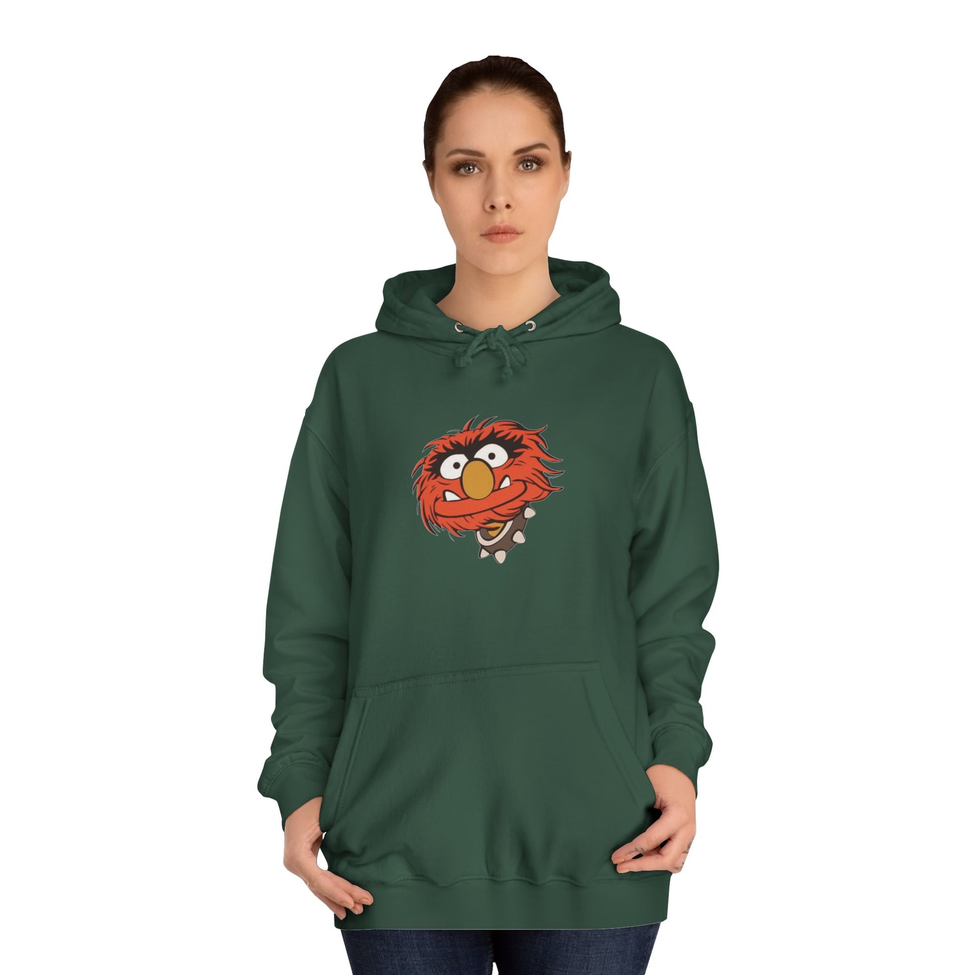 This comfy unisex college hoodie by Printify showcases a vibrant design of a cartoon character with wild orange hair, bulging eyes, and a broad grin on the front, embodying that lively spirit. It's like wearing the Animal - The Muppets hoodie without sacrificing comfort.
