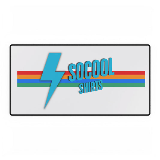 A logo for "SoCool Shirts" features a blue lightning bolt to the left of the brand name, which is written in blue letters against a horizontally striped background consisting of red, yellow, green, and blue colors. The logo sits on a white backdrop with a black border. This design is perfect for customizing desk mats from Printify's SoCool Shirts collection, offering a non-slip base and anti-fray edges.