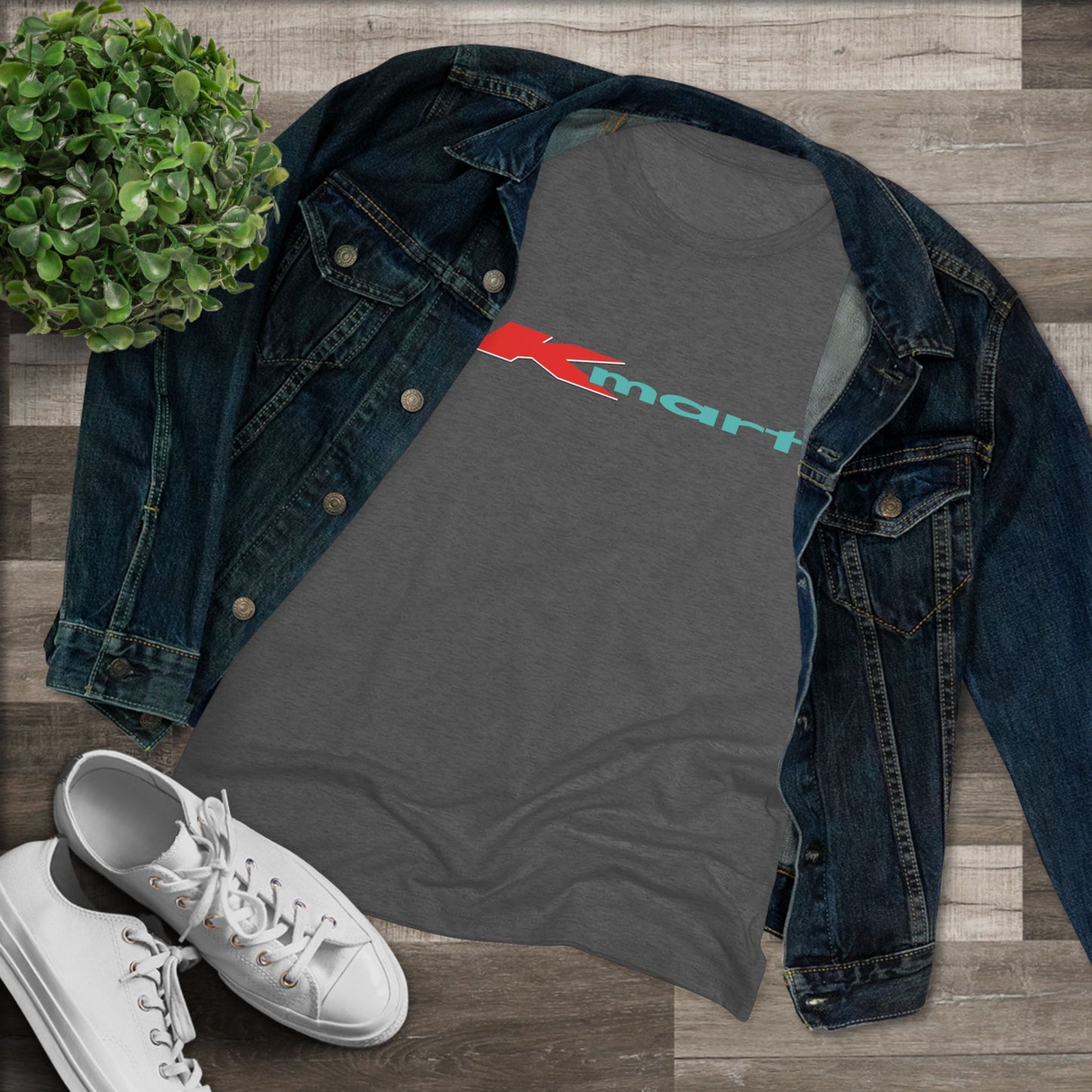 A women's triblend tee by Printify in light gray, featuring a casual and minimalist design that captures the essence of vintage style with a centered 1980s Retro Kmart logo on the front.