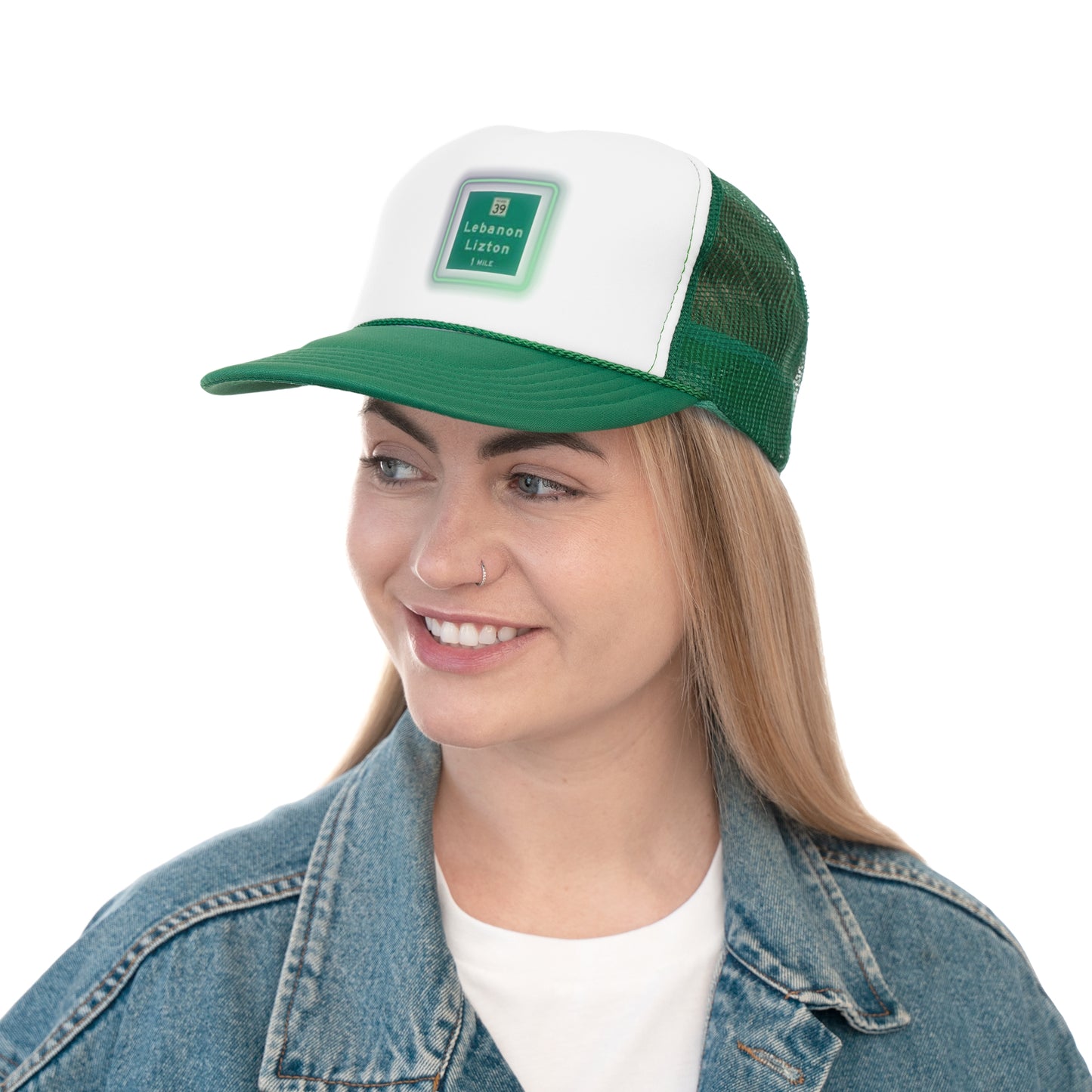 The Printify "The Lebanon Loop - Indiana" trucker cap features a green brim, mesh back, and an adjustable plastic snap closure. It showcases a blurred print of a highway sign that reads "39 Lebanon Lizton 1 mi" in white text on a green background, making it the perfect addition to your collection.