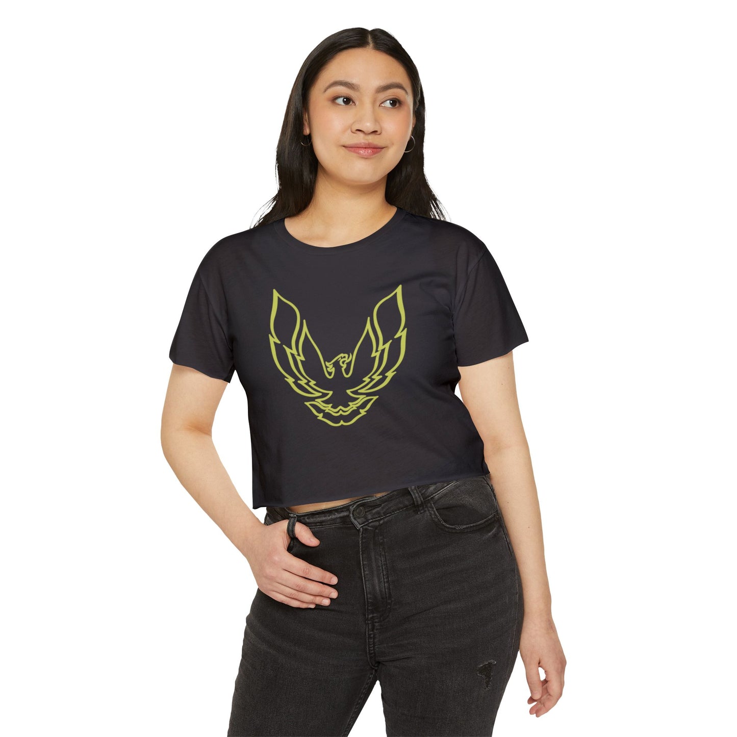 The Pontic Trans Am - Women's Festival Crop Top by Printify is a green heathered crop top featuring a large, stylized yellow eagle graphic with wings spread wide on the front, reminiscent of the Pontiac Phoenix Trans Am logo. With a simple crew neck and short sleeves, this top is ideal for vintage enthusiasts.