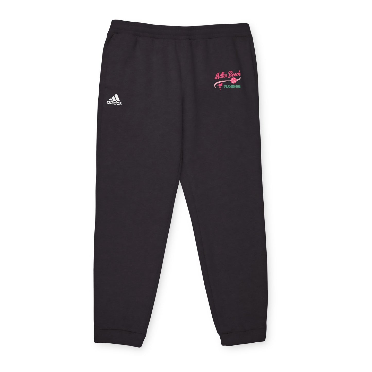 A person is confidently dressed in the cozy Miller Beach Flamingos - Adidas Unisex Fleece Joggers from Printify, featuring "Myrtle Beach" and "Yearround" text in pink and green on the left thigh. They complete their look with a white shirt and gray sneakers, standing against a plain white background.