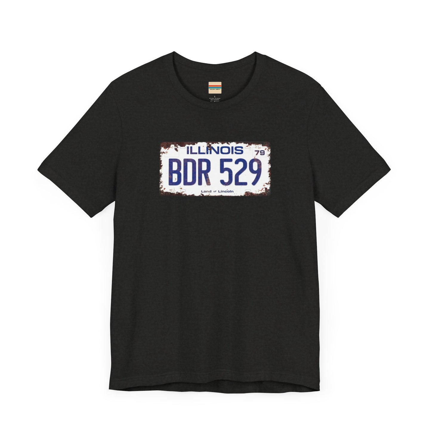 The Printify Blues Brothers BDR 529 License Plate Unisex Jersey Short Sleeve Tee showcases a vintage Illinois license plate graphic with "BDR 529" prominently displayed, as famously seen in the Blues Brothers film. The design includes "Illinois" and "Land of Lincoln" above and below the numbers, with a weathered, rustic look that enhances its retro appeal.