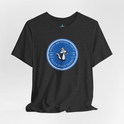 The Printify Miller Beach Skunks - Unisex Jersey Short Sleeve Tee is a gray T-shirt that features a circular blue logo at the center. Inside the logo, there is an illustration of a skunk with the text "Protect Our Habitat" and "Miller Beach Skunks" around the border, promoting environmental consciousness. The upper left part of the logo reads "Gary, IN.