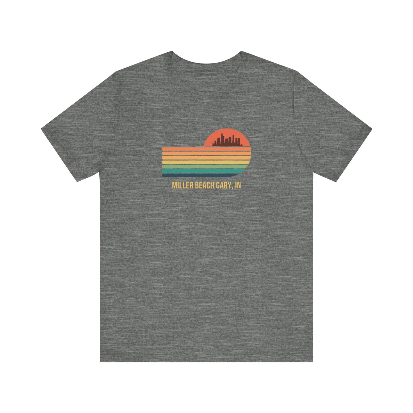 Introducing the Miller Beach Gary, IN Sunset Gradient - Unisex Jersey Short Sleeve Tee by Printify. This stylish blue T-shirt features a circular sunset graphic on the chest, showcasing a black city skyline silhouette against an orange-red sunset with horizontal stripes in green, yellow, and orange. Below the graphic reads "MILLER BEACH GARY, IN." Crafted from soft cotton for extra beachy charm.