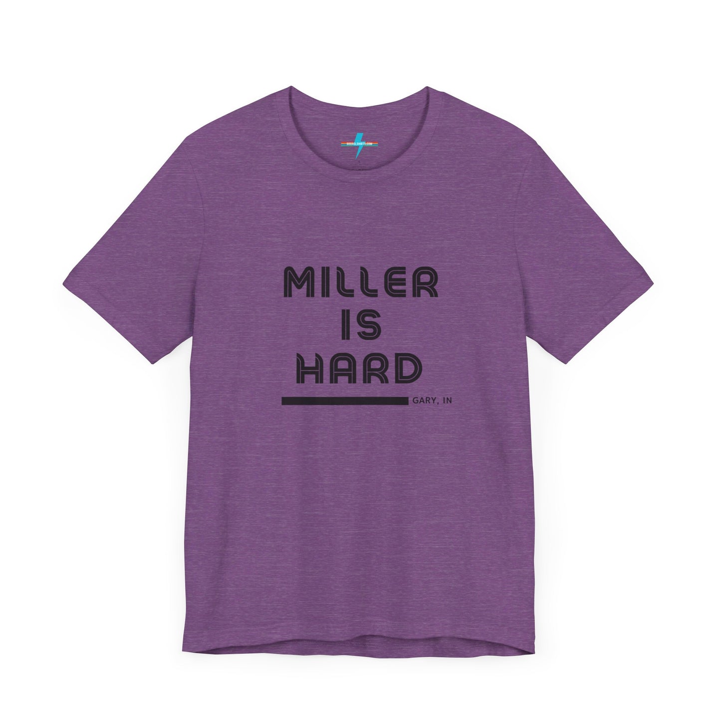 A unisex jersey short sleeve tee from Printify in burnt orange features the bold black text "MILLER IS HARD" on the chest, with "GARY, IN" written beneath in smaller black font. Perfect for showcasing Miller Beach's iconic spirit, this t-shirt is displayed against a plain white background.