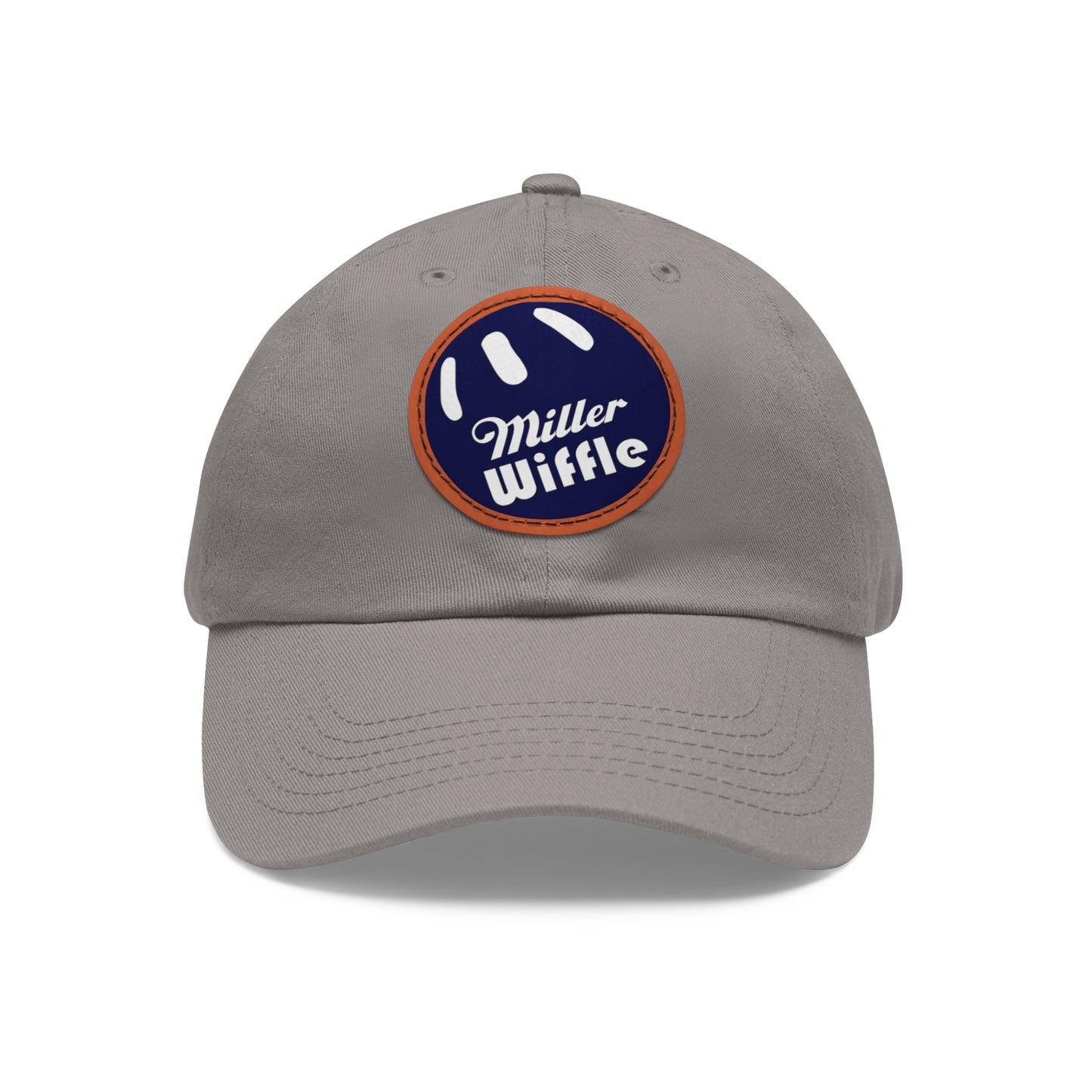 A gray dad hat by Printify, crafted from bio-washed chino twill, featuring a circular blue and white leather patch on the front. The patch showcases a baseball design with "Miller Wiffle" written in cursive font.