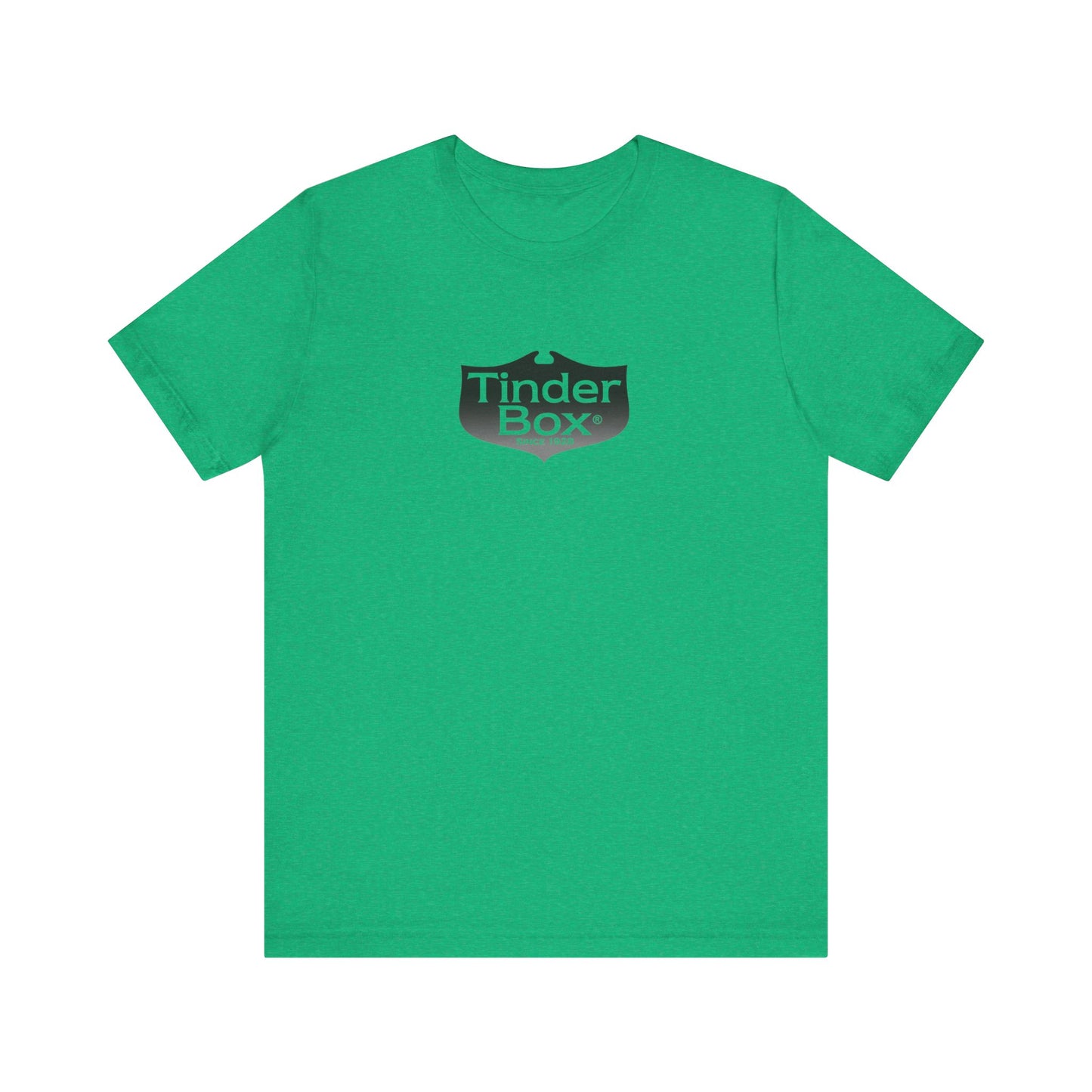 A light blue Printify "The Tinder Box 1980s" unisex jersey short sleeve tee featuring the "Tinder Box" logo in the center. The logo consists of a dark shield with the words "Tinder Box" in white text, with a small flame icon replacing the dot above the "i".