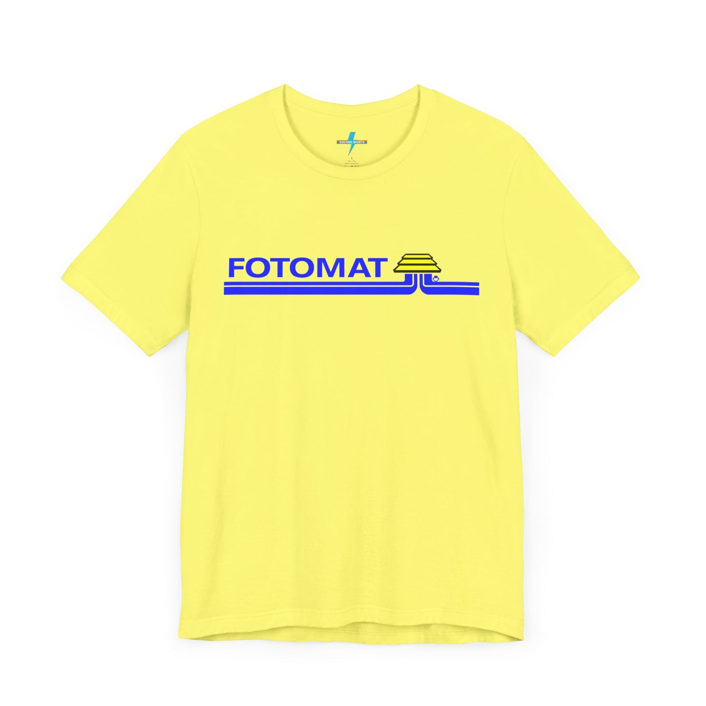 The Fotomat 1970s Retro T-Shirt by Printify is a dark gray short-sleeve shirt that features the word "FOTOMAT" in bold blue capital letters and a blue and yellow graphic design resembling layered lines and an upside-down triangle. This Tshirt captures the essence of 80s nostalgia with its centered, retro design.