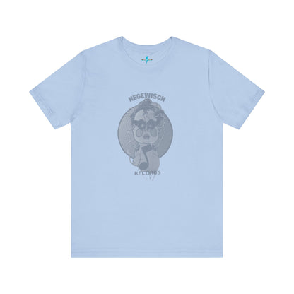 Introducing the Hegewisch Records - Retro 1980s Unisex Jersey Short Sleeve Tee by Printify: This light blue T-shirt features a central printed design with a monochromatic illustration of a stylized cartoon character with large eyes, holding or playing a vinyl record. Above the character, the text reads "Hegewisch Records" – an ideal choice for music lovers.