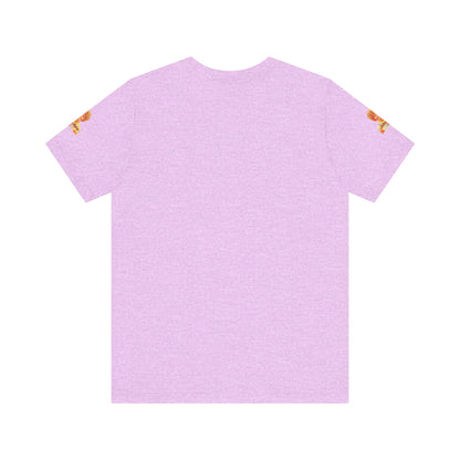 A lavender-colored Helen (Mrs.) Roper Three's Company - Unisex Jersey Short Sleeve Tee by Printify is hanging on a wooden hanger against a white background. This T-shirt features an image of a smiling person with curly hair wearing a colorful blouse, with the text "Helen Roper" underneath the image. Both sleeves have identical designs, making it perfect Three's Company merchandise.