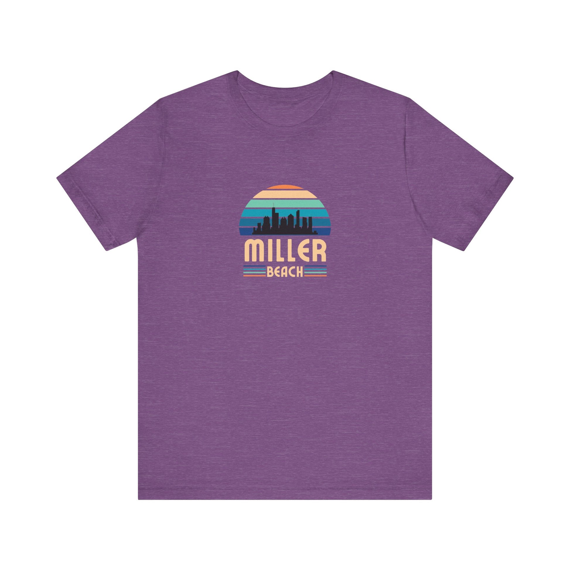 A brown unisex jersey short sleeve tee called "Miller Beach Chicago Skyline" from Printify features a vintage-style design with a sunset, the Chicago skyline, and "Miller Beach" in bold letters. The design incorporates shades of blue, orange, and yellow and is displayed against a plain white background.