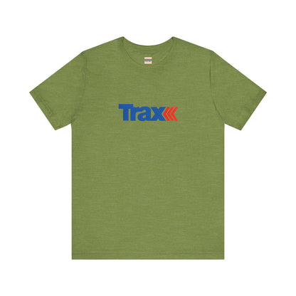 A gray unisex jersey short sleeve tee from Printify, inspired by retro 1980s Kmart style. The "Trax" logo is printed in blue letters, followed by three red arrows pointing to the right. This classic Trax Brand T-shirt is laid flat against a white background, capturing nostalgic fashion vibes.