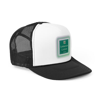 The Printify "The Lebanon Loop - Indiana" trucker cap features a green brim, mesh back, and an adjustable plastic snap closure. It showcases a blurred print of a highway sign that reads "39 Lebanon Lizton 1 mi" in white text on a green background, making it the perfect addition to your collection.