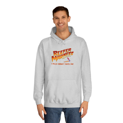 Introducing the "Reefer Madness - A Miller Community Theatre Joint" hoodie by Printify—a green hoodie with "Reefer Madness The Musical" displayed in bold, colorful font. Beneath it, the phrase "A very scary trip!" is featured. This hoodie is ideal for fans of the Miller Community Theatre production and comes with a front pocket and a drawstring hood.