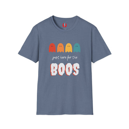 The "Just Here for the Boos - Halloween - Unisex Softstyle T-Shirt" by Printify is a blue, unisex tee with a playful Halloween theme. It features four ghost icons in red, orange, yellow, and green, followed by the text "just here for the BOOS" with "BOOS" styled in a bold and spooky font. Perfect for embracing the spooky season!