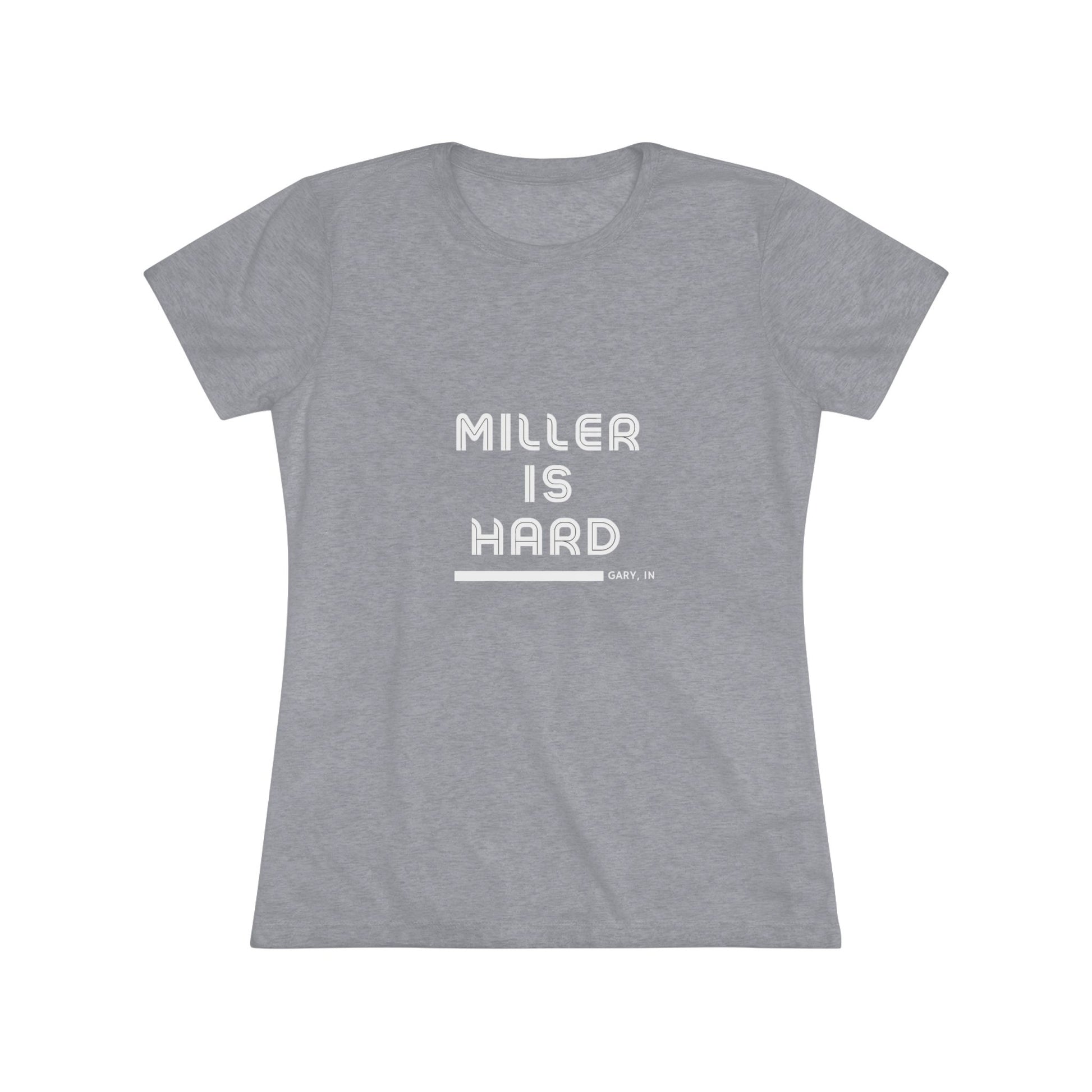 The Miller is Hard - Miller Beach Women's Triblend Tee by Printify features unique red coloring with white text that reads "MILLER IS HARD" and "GARY, IN" below, showcasing distinctive lettering spacing and alignment. Made from ultra-soft fabric, this shirt ensures a comfortable fit with a simple, casual design.