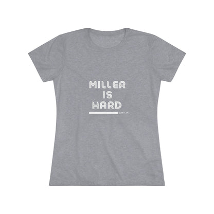 The Miller is Hard - Miller Beach Women's Triblend Tee by Printify features unique red coloring with white text that reads "MILLER IS HARD" and "GARY, IN" below, showcasing distinctive lettering spacing and alignment. Made from ultra-soft fabric, this shirt ensures a comfortable fit with a simple, casual design.