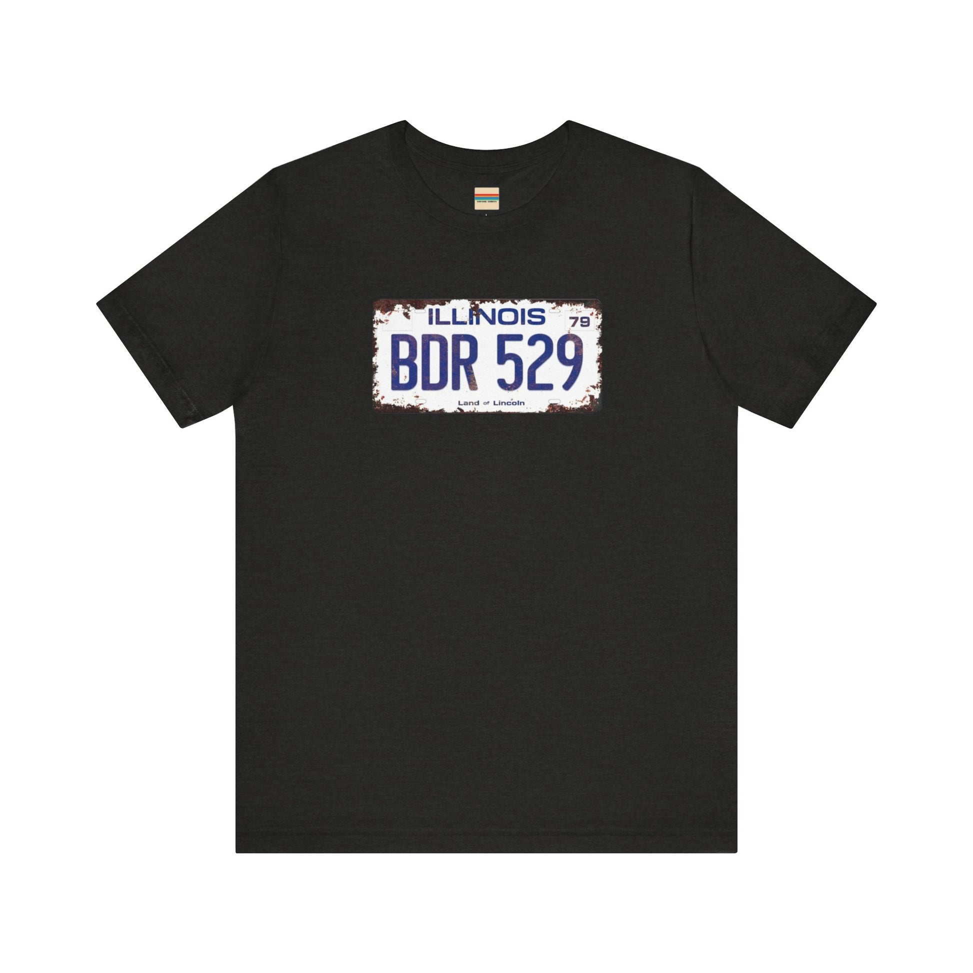 The Printify Blues Brothers BDR 529 License Plate Unisex Jersey Short Sleeve Tee showcases a vintage Illinois license plate graphic with "BDR 529" prominently displayed, as famously seen in the Blues Brothers film. The design includes "Illinois" and "Land of Lincoln" above and below the numbers, with a weathered, rustic look that enhances its retro appeal.