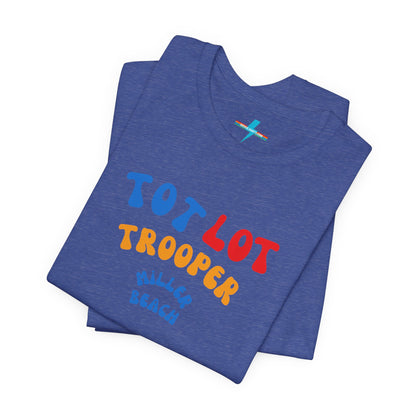 A green unisex jersey short sleeve tee from Printify, featuring colorful text on the front that reads "TOT LOT TROOPER MILLER BEACH" in blue, red, yellow, and orange letters. The shirt is displayed against a plain white background.