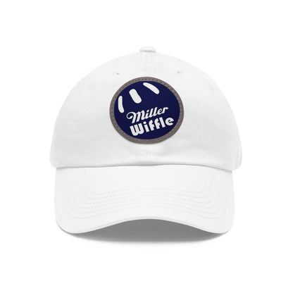 A gray dad hat by Printify, crafted from bio-washed chino twill, featuring a circular blue and white leather patch on the front. The patch showcases a baseball design with "Miller Wiffle" written in cursive font.