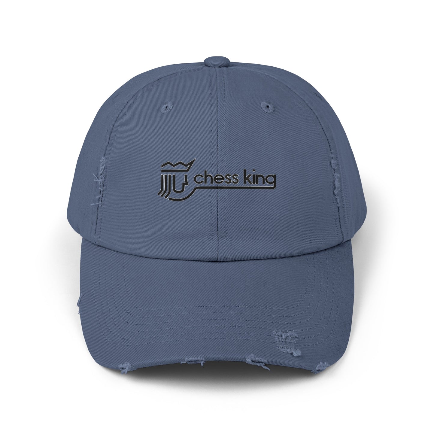 The 1980s Chess King Clothing Store Logo - Unisex Distressed Cap by Printify is a beige baseball cap made from 100% cotton twill. It features intentional distress details and a logo with a crown and rook piece, along with the text "chess king" embroidered on the front, making it a stylish choice for custom caps enthusiasts.