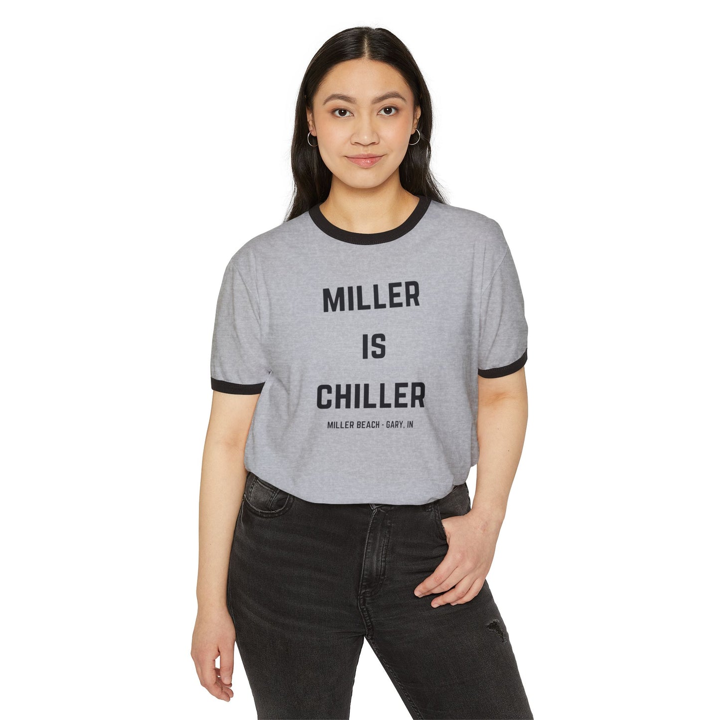 Introducing the Printify "Miller is Chiller - Miller Beach" Unisex Cotton Ringer T-Shirt: a gray shirt featuring black trim on the collar and sleeves. The bold black text "MILLER IS CHILLER" stands out, with "MILLER BEACH - GARY, IN." displayed underneath in smaller letters. Ideal for a day at Lake Michigan.