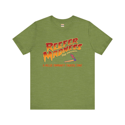 The Miller Community Theatre - Reefer Madness Cast and Crew Shirt by Printify showcases a vibrant design featuring bold, colorful text that reads "Reefer Madness The Musical" with a cartoon joint illustration. Below the main text, "A Miller Community Theatre Joint" is highlighted in red. This limited-edition green t-shirt, with its centered design, is perfect for cast and crew members.