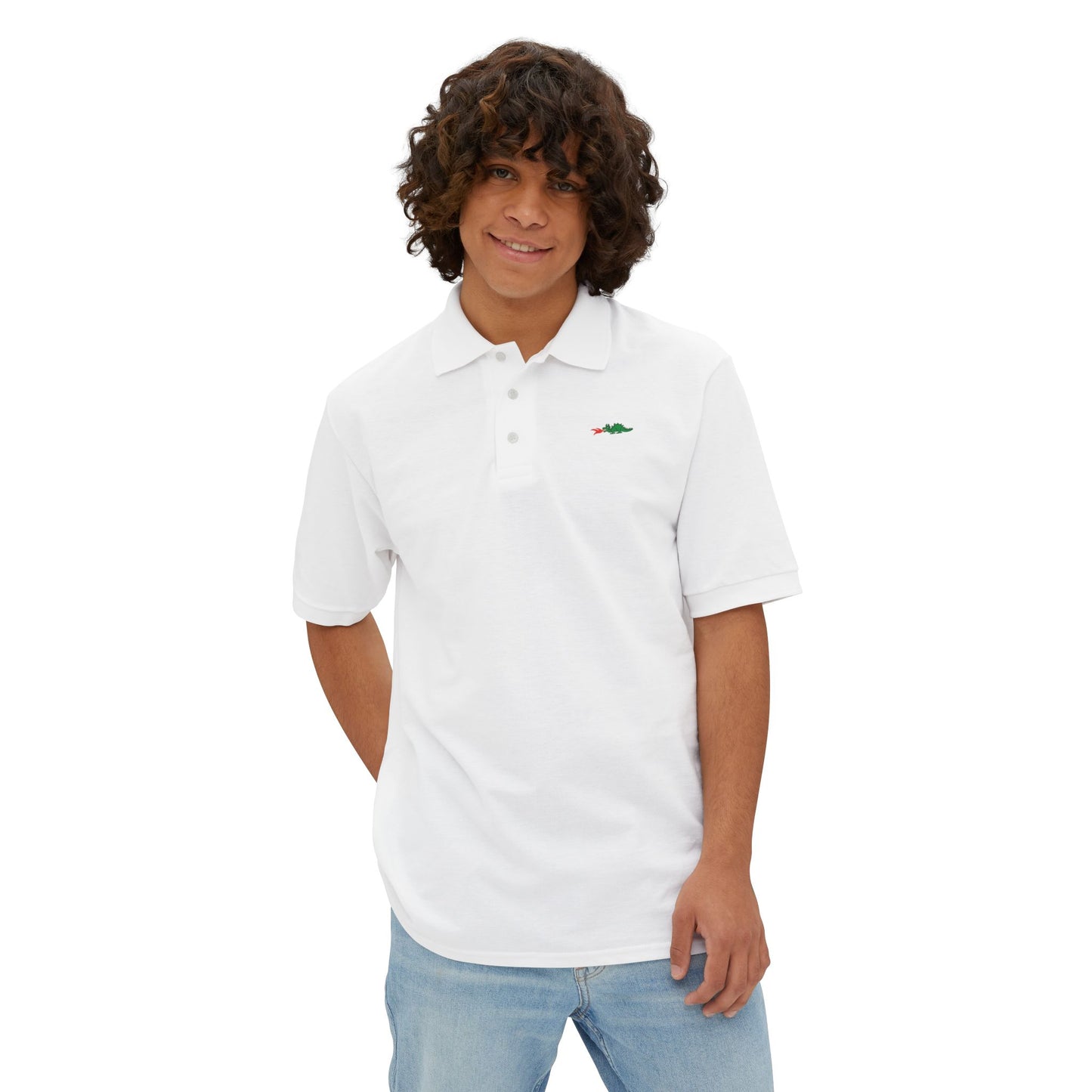 A person with curly hair wearing a navy blue Printify Braggin' Dragon - 1980s Sears Men's Piqué Polo, featuring a small embroidered dragon logo on the left chest, smiles against a plain white background.