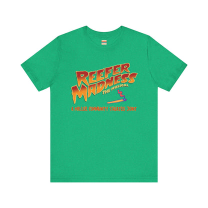 The Miller Community Theatre - Reefer Madness Cast and Crew Shirt by Printify showcases a vibrant design featuring bold, colorful text that reads "Reefer Madness The Musical" with a cartoon joint illustration. Below the main text, "A Miller Community Theatre Joint" is highlighted in red. This limited-edition green t-shirt, with its centered design, is perfect for cast and crew members.