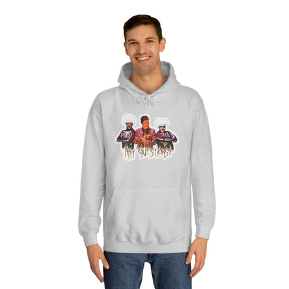 The David S Pumpkins - Any Questions? - Halloween Unisex College Hoodie by Printify is a brown sweatshirt showcasing an illustration of three people. The central figure has red hair, sports a colorful ensemble, and emanates a Halloween vibe, with two flanking figures who have white hair and wear dark attire. Beneath the trio is the phrase "Any Questions?