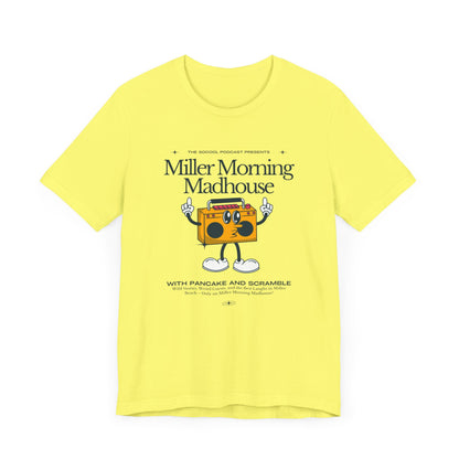 This Printify unisex jersey short sleeve tee in Sand Dune features a playful boombox cartoon character with arms, legs, and sunglasses. Emblazoned with "Miller Morning Madhouse," it highlights podcast details from "The School Podcast Presents.