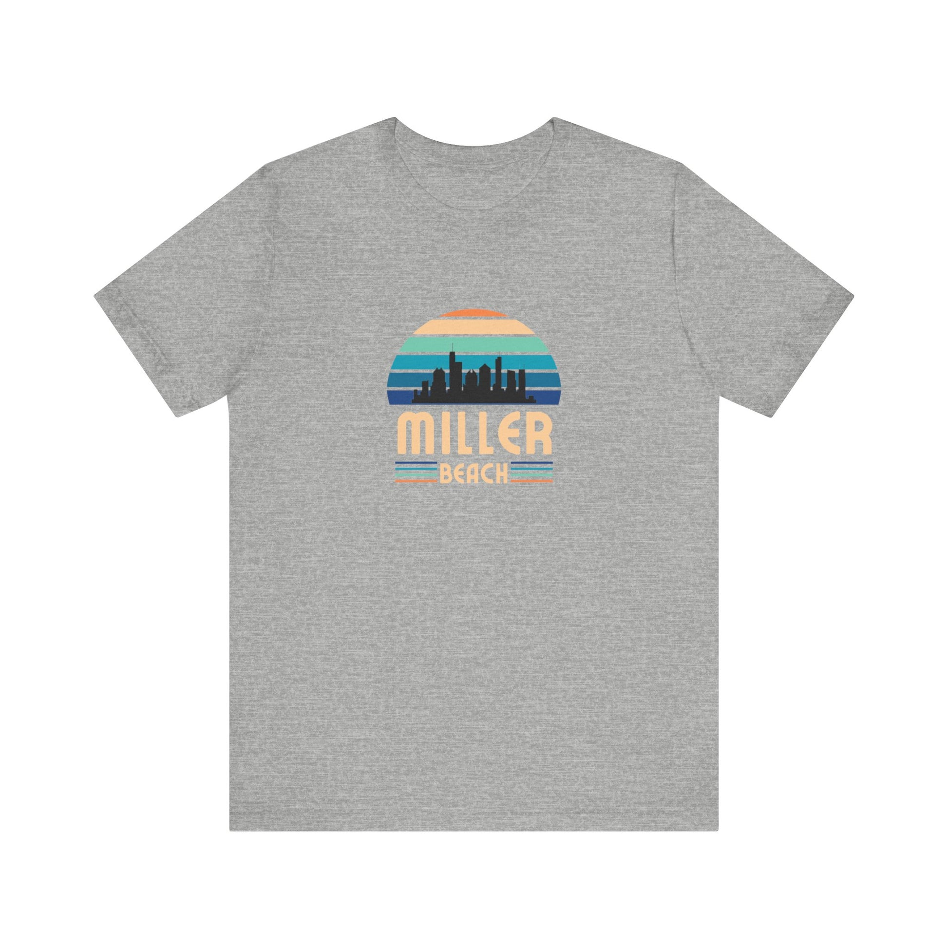 The Printify Miller Beach Chicago Skyline - Unisex Jersey Short Sleeve Tee is a light blue T-shirt featuring a stylized graphic of the Chicago skyline against a setting sun with gradient shades of blue and orange. Below the graphic, "Miller Beach" is printed in bold, yellow letters.