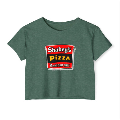 The Shakey's Pizza - Women's Festival Crop Top from Printify is a light blue garment that proudly displays the iconic Shakey's Pizza logo on the chest. Featuring retro-style red and black signage with text in white, yellow, and red that reads "Shakey's Pizza Restaurant," this crop top exudes a vintage-inspired charm.