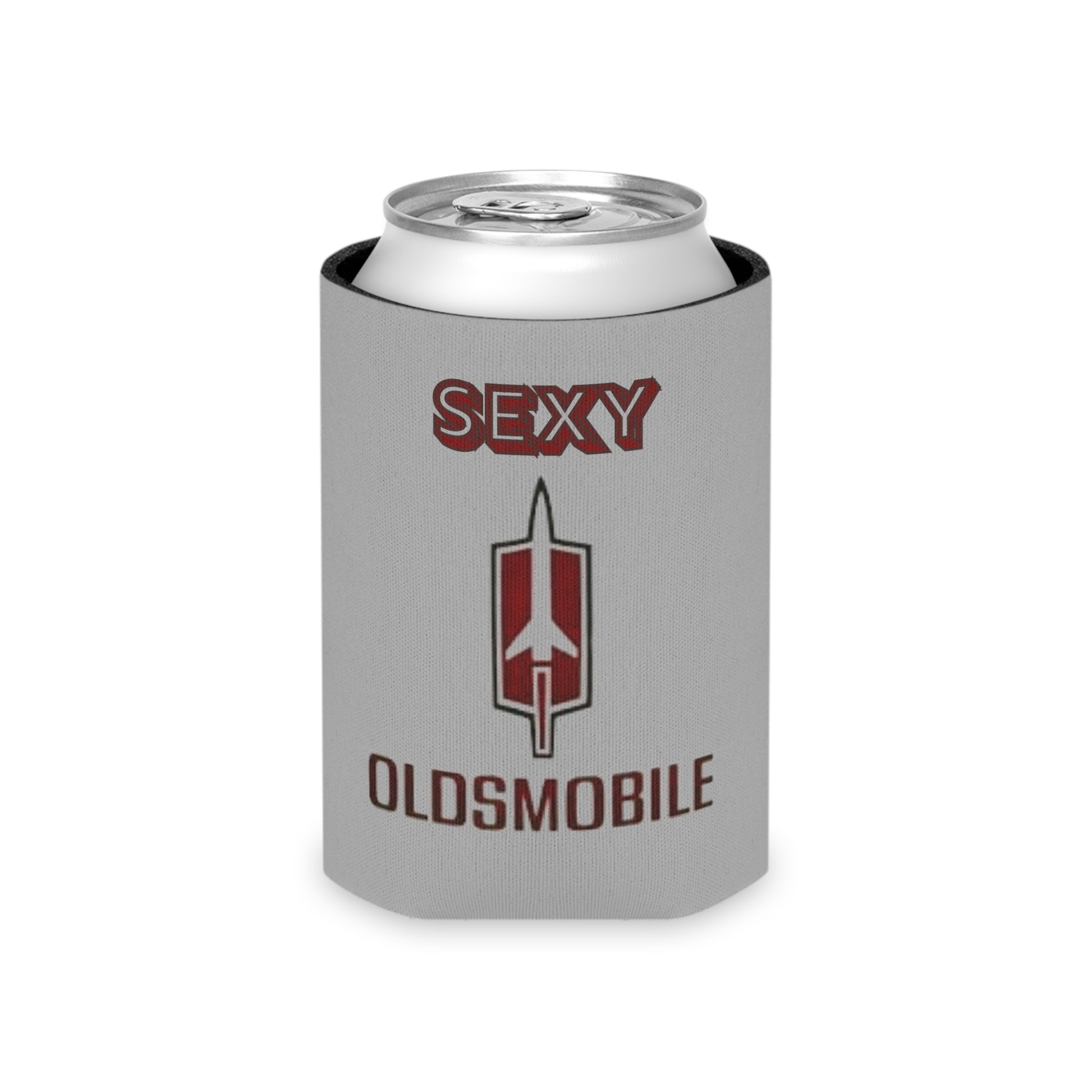 The Sexy Oldsmobile Koozie by Printify features "SEXY" in red at the top on a gray background, followed by the Oldsmobile logo and the word "OLDSMOBILE" below it. At the bottom, there's a blue and red logo reading "SOCOOLSHIRTS.COM." This koozie has an indentation designed to hold a can securely.