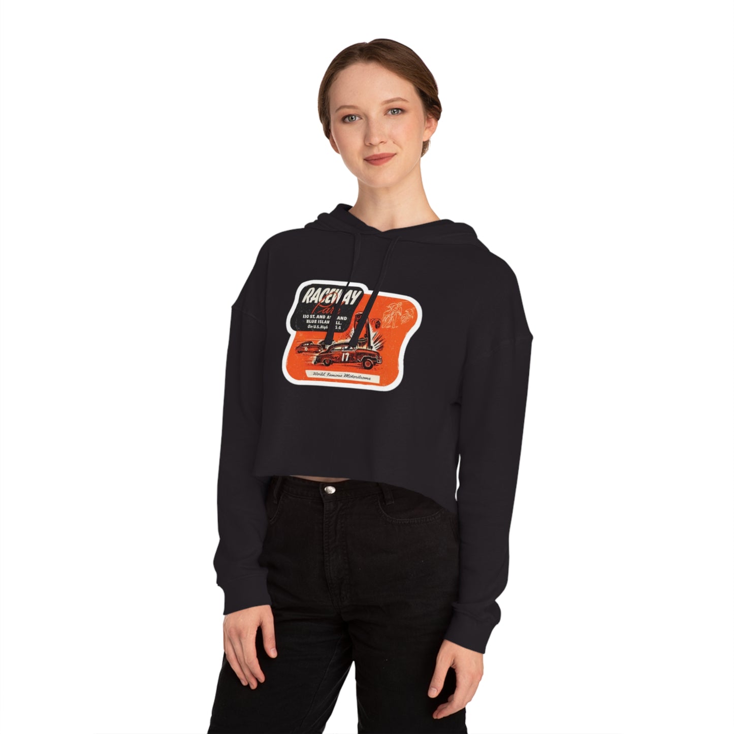 The Raceway Park - Blue Island, IL Women's Cropped Hooded Sweatshirt by Printify features an eye-catching camouflage pattern with a bold red and black "Raceway Park" graphic. Perfect for car enthusiasts, it is adorned with images of cars and text that celebrate a fictional race and hot rod theme, capturing the spirit of Blue Island racers.