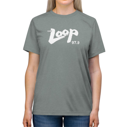 A plain grey Printify The Loop - Chicago - 97.9 Radio Unisex Triblend Tee with a white logo that says "The Loop 97.9" in a stylized font across the chest. The shirt has short sleeves and a round neckline, perfect for any classic rock fan.